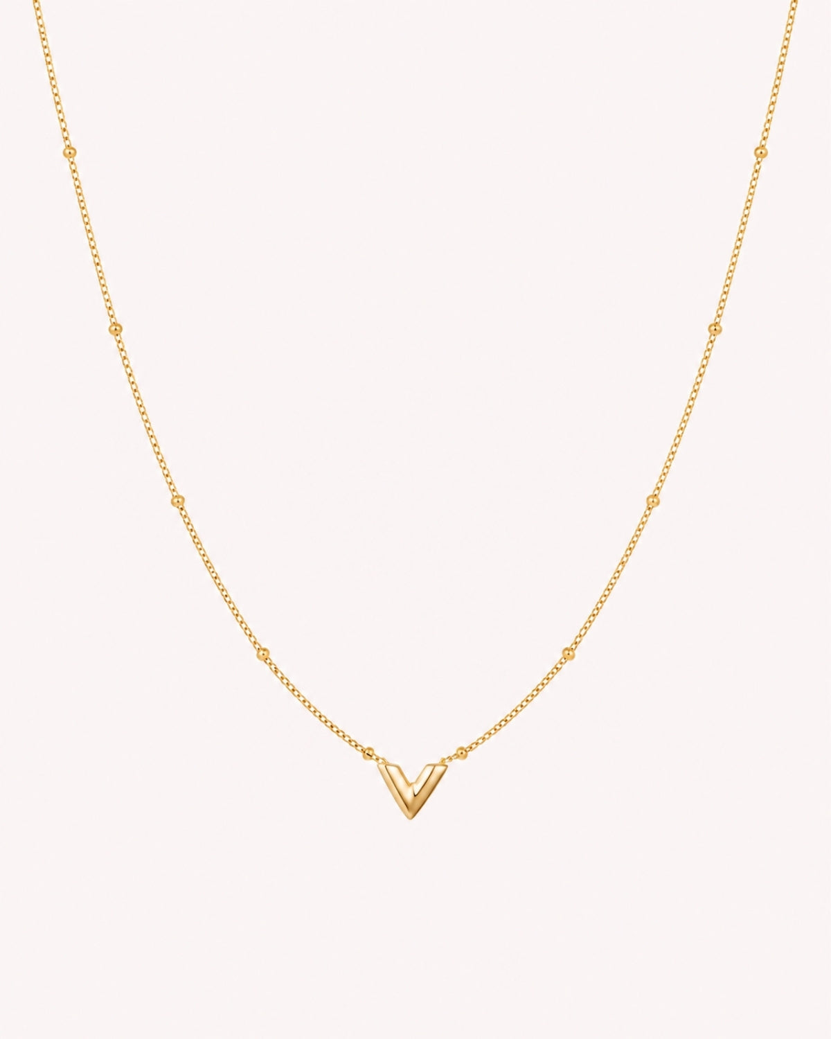 Ketting met V hanger en bolletjes