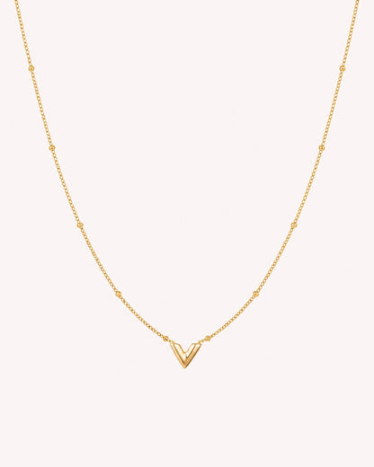 Ketting met V hanger en bolletjes